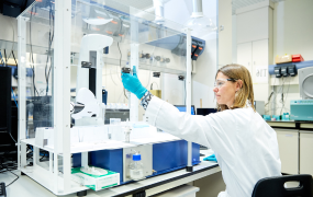 Picture of a UCB employee working in a laboratory