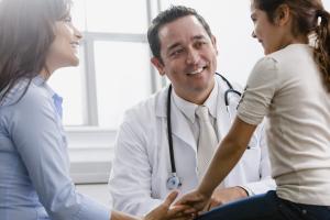 Clinical studies scientist speaking with a child