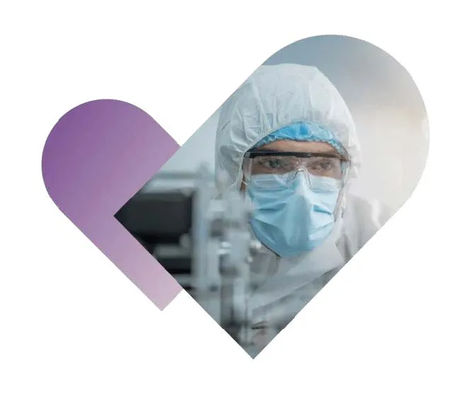 Picture of a man working in a lab wearing security clothes