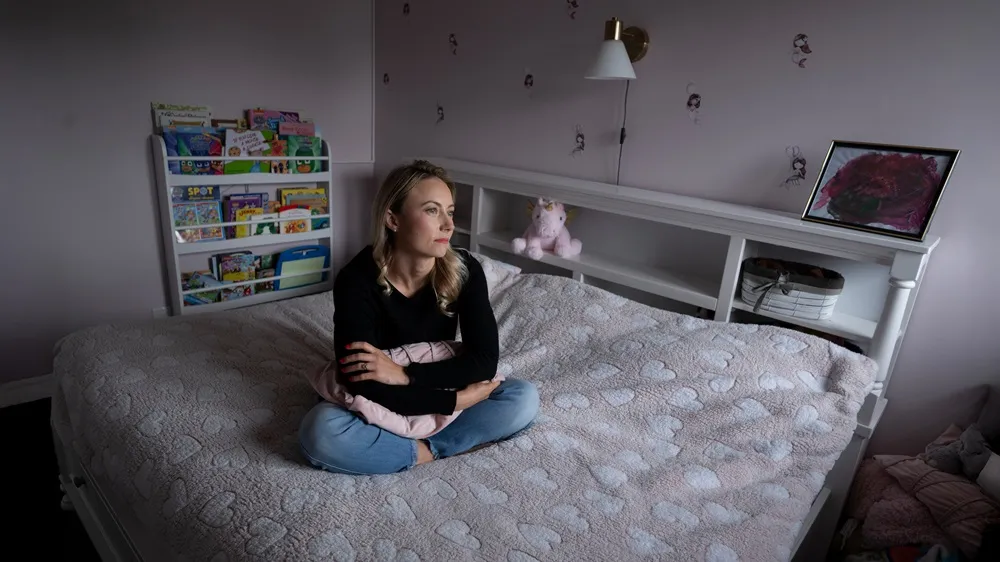 Picture of Candace living with myasthenia gravis in her bedroom